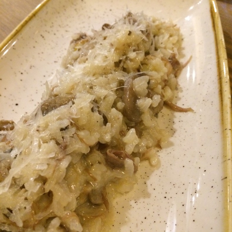 Arroz meloso con pato y aceite de trufa
